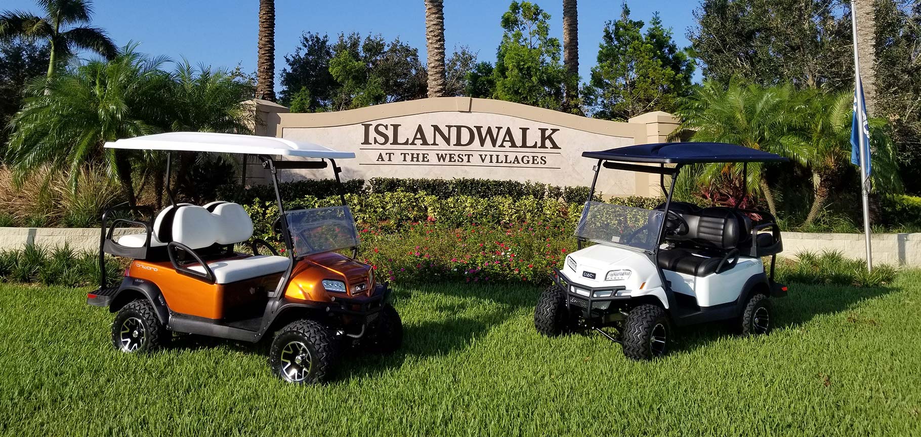 Islandwalk entrance sign with golf carts image