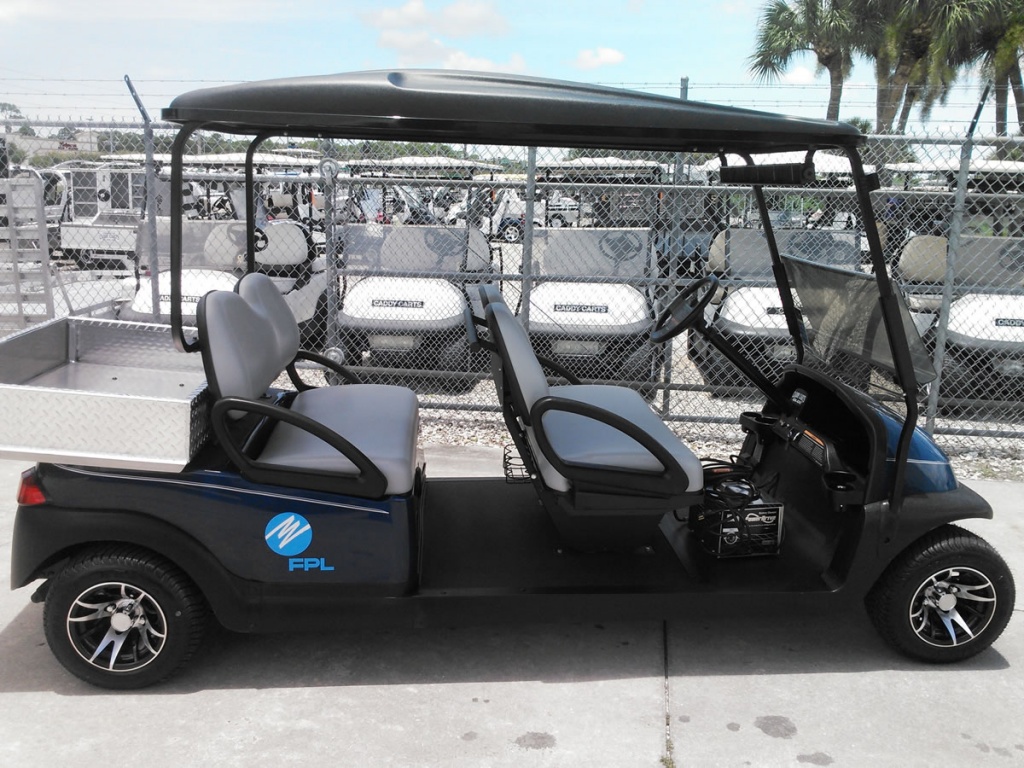 Black golf cart with storage bed image